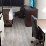 one king bed room amenities including TV and work desk
